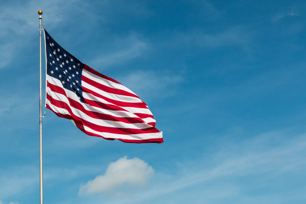 United-States-Of-America-Flag-on-blue-sky-background