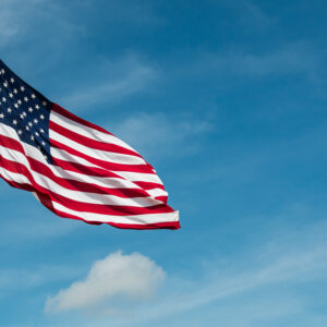 United-States-Of-America-Flag-on-blue-sky-background