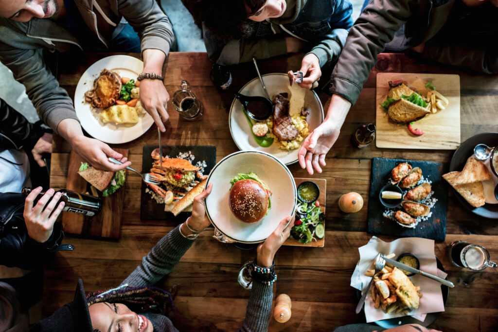 Family enjoys meal and activity together. Things to do in Utah.