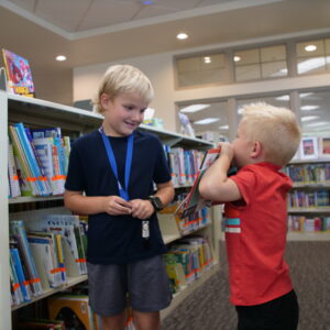 two-children-picking-out-books