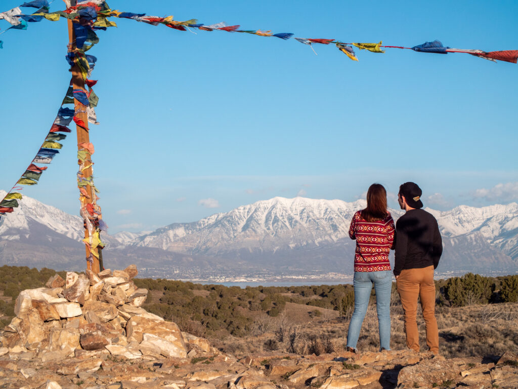 back-of-heads-prayer-flags-Eagle-Mountain-view