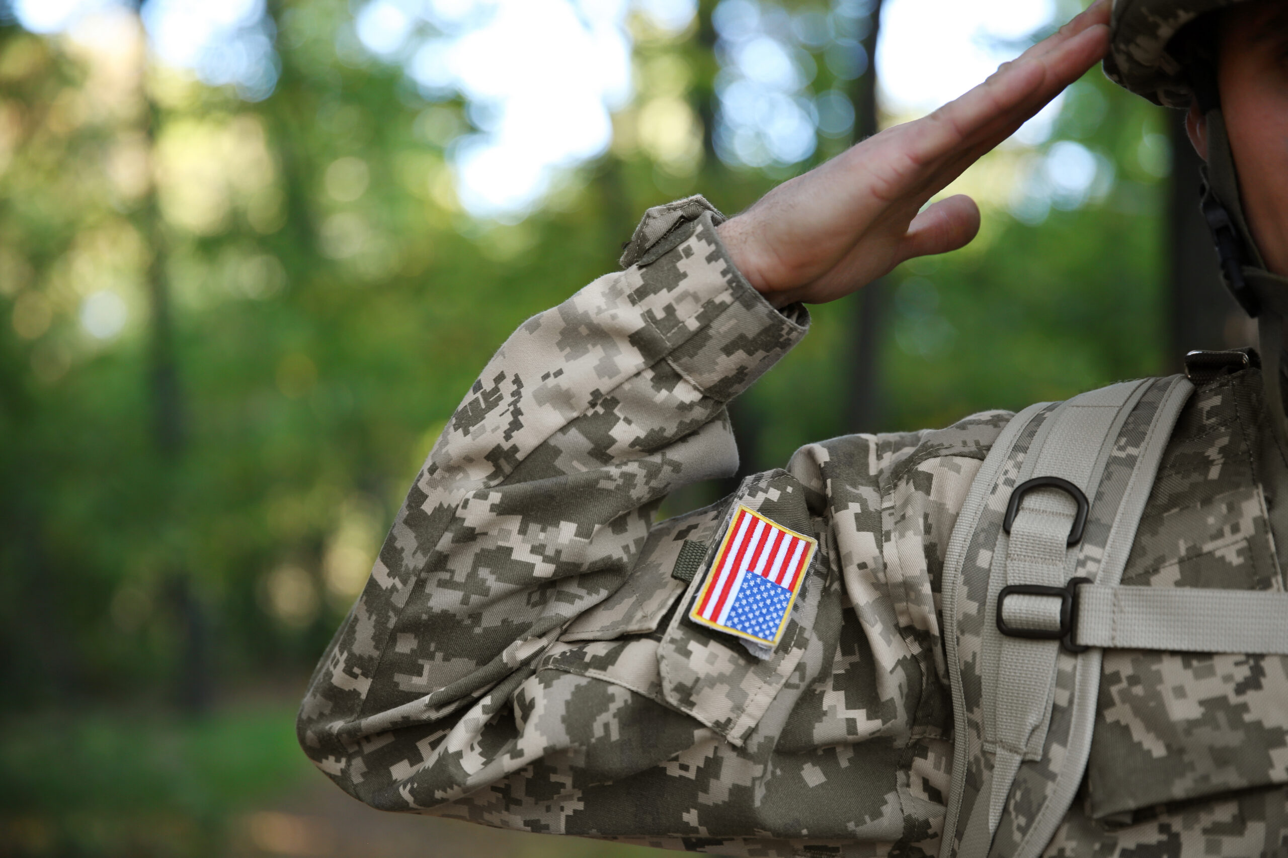 Soldier-in-camouflage-taking-salute