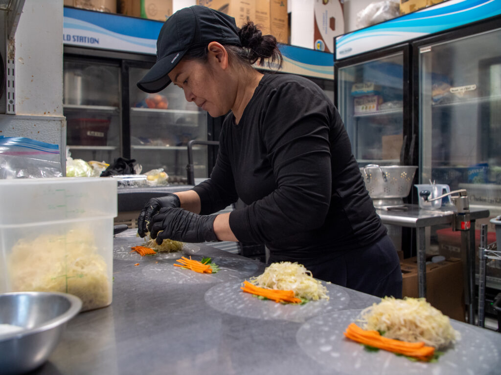 woman-looking-at-food-she-is-prepping