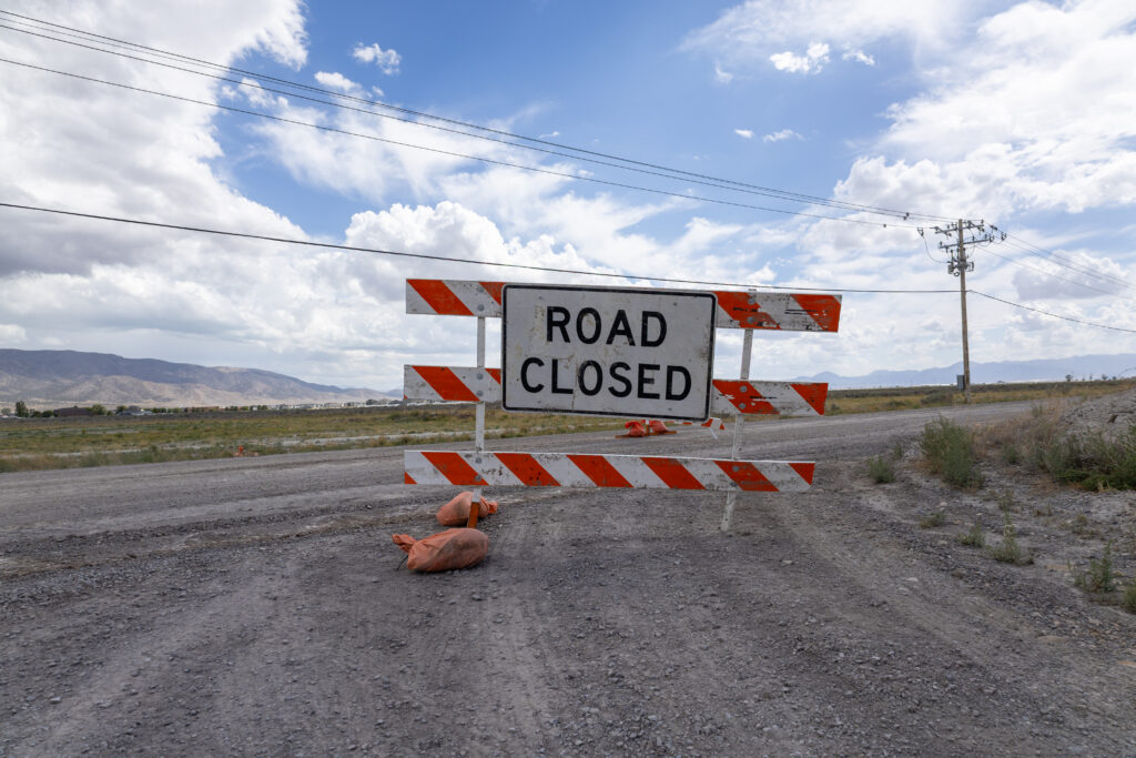 Road closure sign for Lehi Fairfield Road in Eagle Mountain