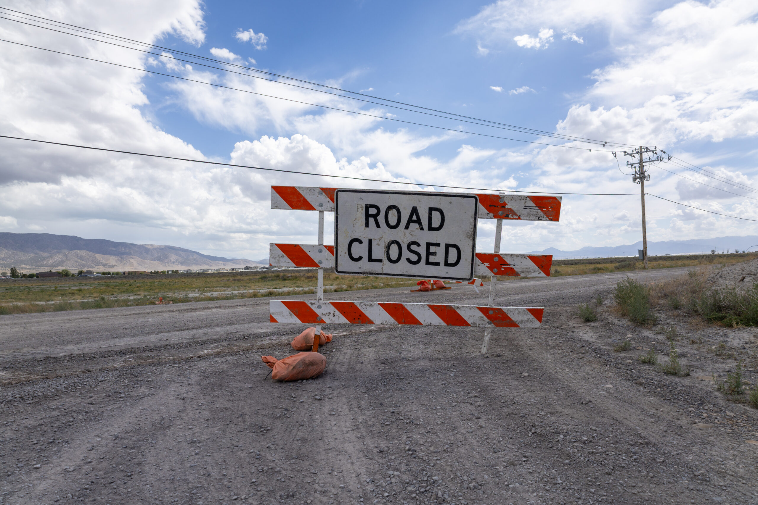Road closure sign for Lehi Fairfield Road in Eagle Mountain